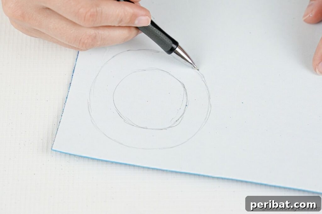 DIY Painted Tin Can Snowman Video Tutorial 15 A person drawing another circle on foam paper, slightly larger than the previous one, to complete the hat brim outline.