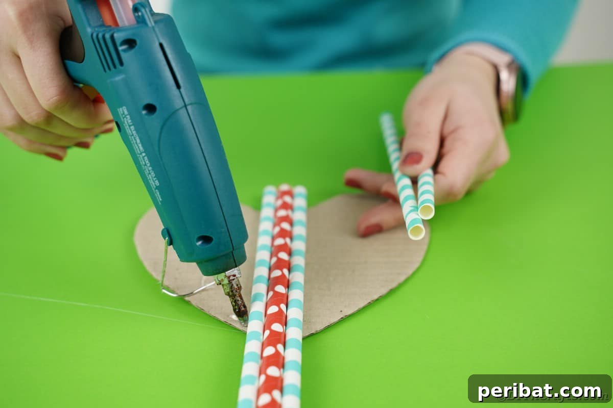 Crafty Paper Straw Heart Wall Decor 10 Gluing straws onto cardboard heart