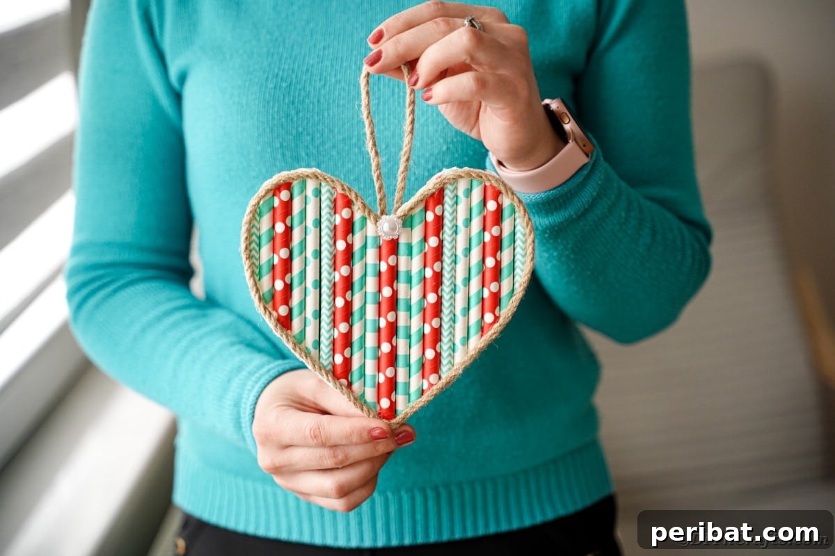 Crafty Paper Straw Heart Wall Decor 3 Woman holding paper straw heart