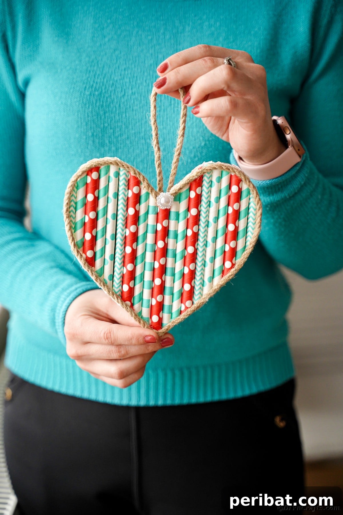 Crafty Paper Straw Heart Wall Decor 18 Woman holding paper straw heart