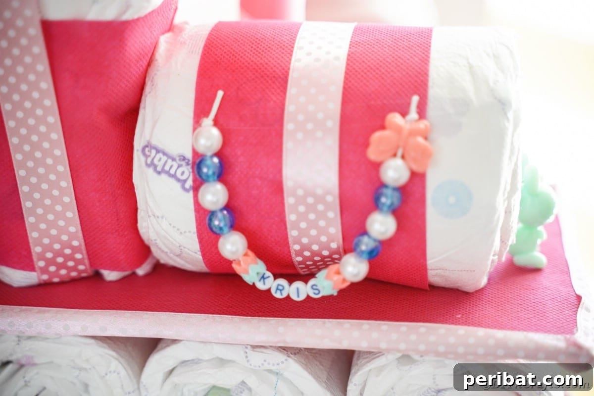 Create a Charming Diaper Train for Baby Shower Joy 5 Close-up detail of the intricate decorations on a diaper cake, showcasing the careful assembly and charming embellishments.