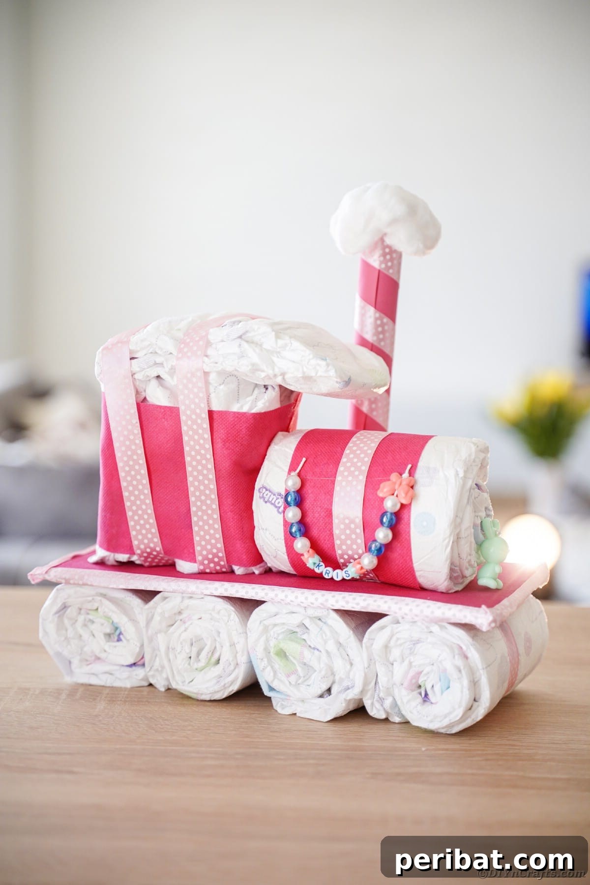 Create a Charming Diaper Train for Baby Shower Joy 30 The diaper cake train elegantly displayed on a table, serving as a charming centerpiece for a baby shower gathering.
