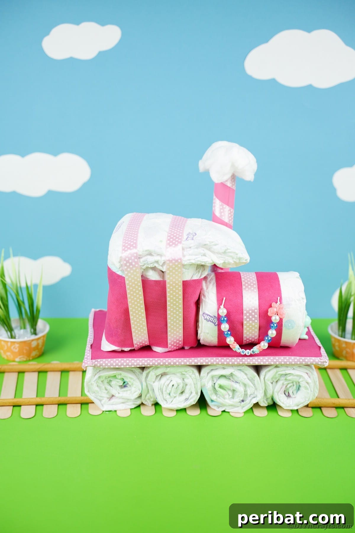 Create a Charming Diaper Train for Baby Shower Joy 31 A stunning diaper cake train set against a whimsical blue background with fluffy clouds, emphasizing its dreamy and joyful aesthetic.