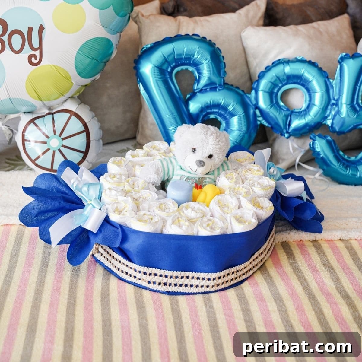 Adorable Candy Wrapper Diaper Cake showcased on a soft bed, ready as a perfect baby shower gift or nursery decoration.