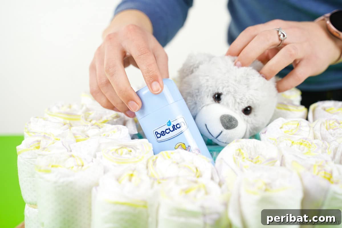 Adding lotion to diaper cake