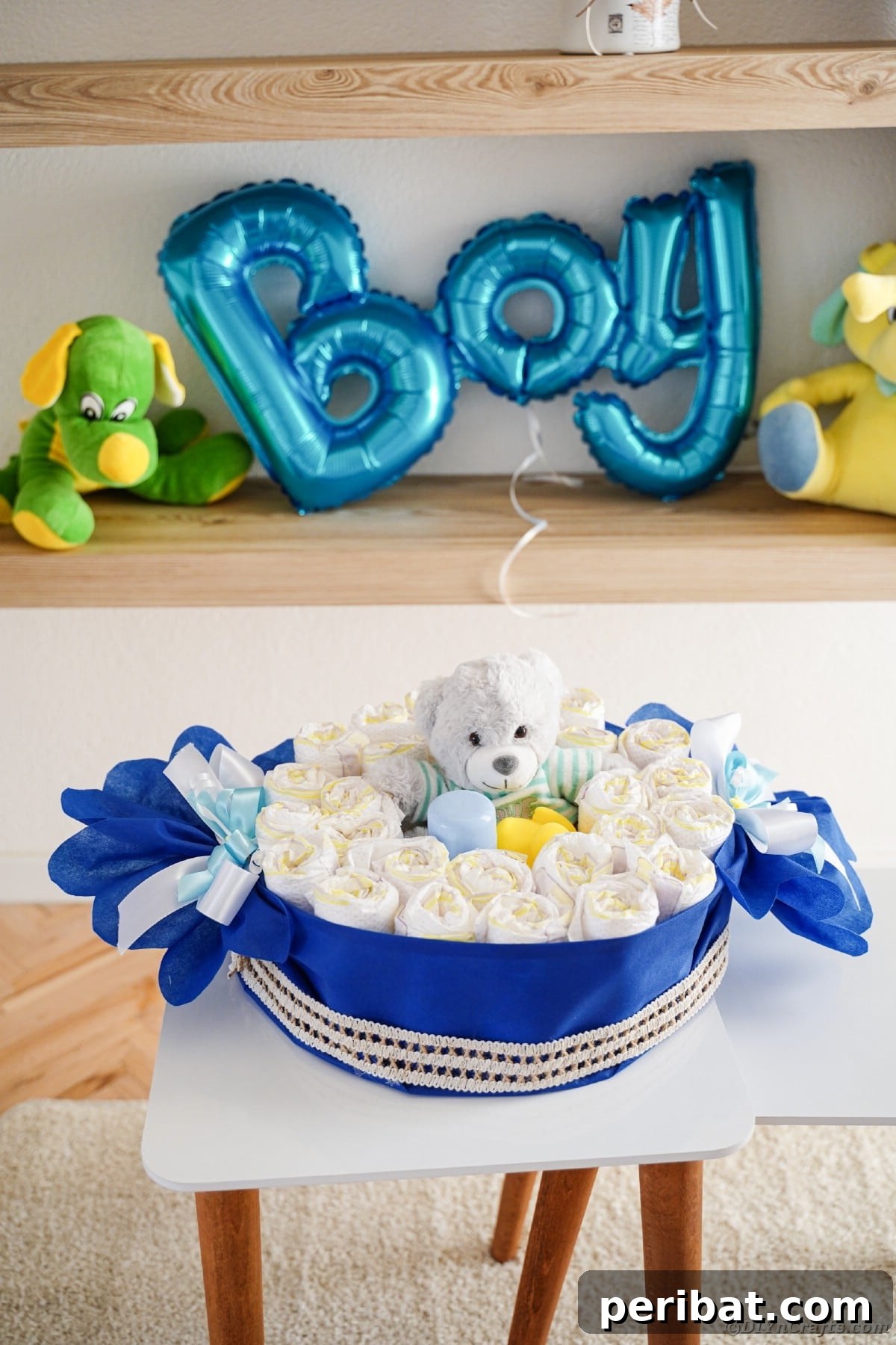 A vibrant candy piece diaper cake on a pristine white table, highlighting the thoughtful gifts nestled within its layers.