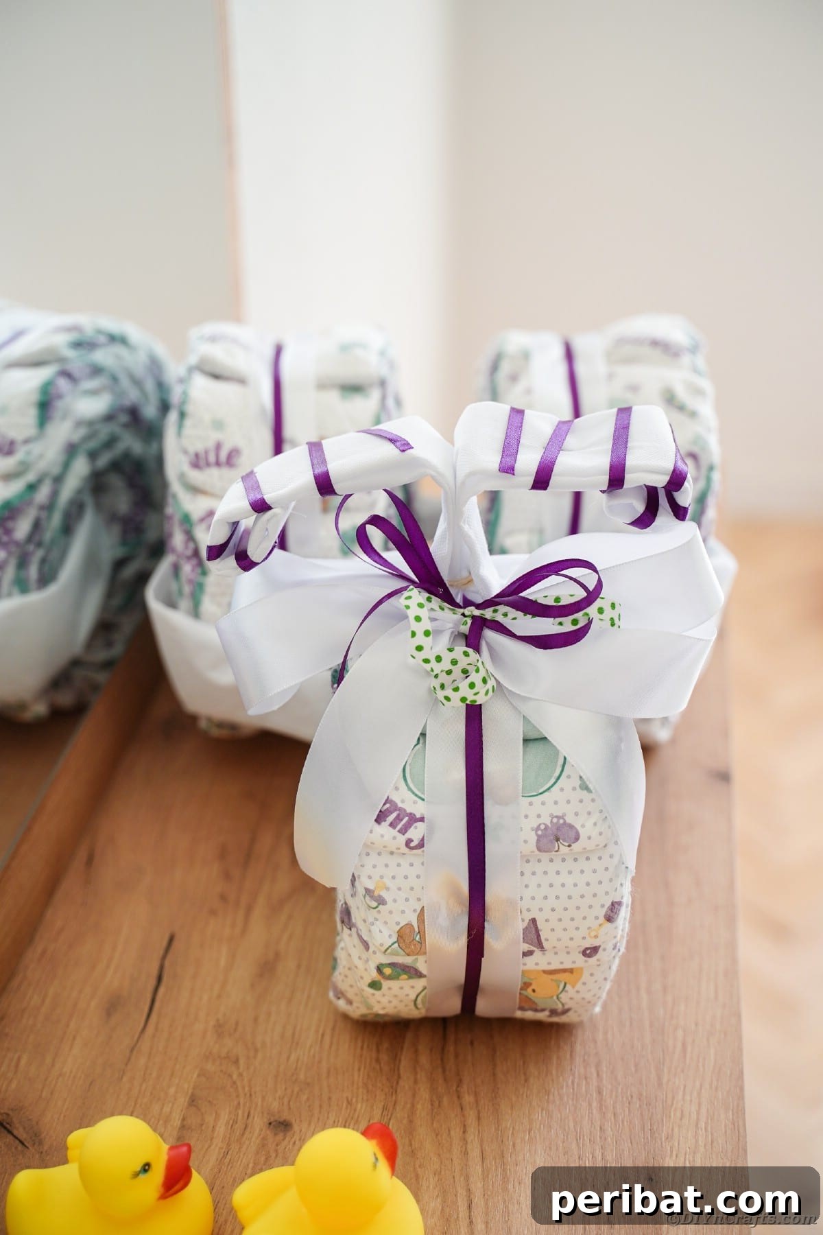 Charming bike diaper cake on a dresser, showcasing customization