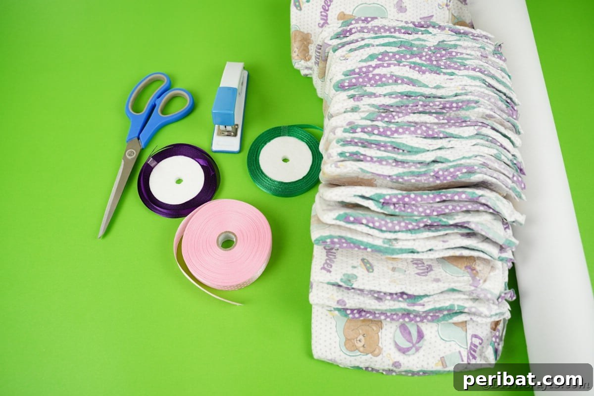 Tricycle diaper cake supplies laid out on a table