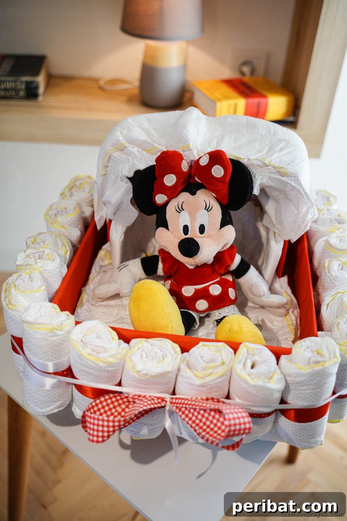 Charming Diaper Bassinet: A Perfect Baby Shower Present 20 A completed bassinet diaper cake on a table, showcasing its final decorative touches and readiness as a gift.