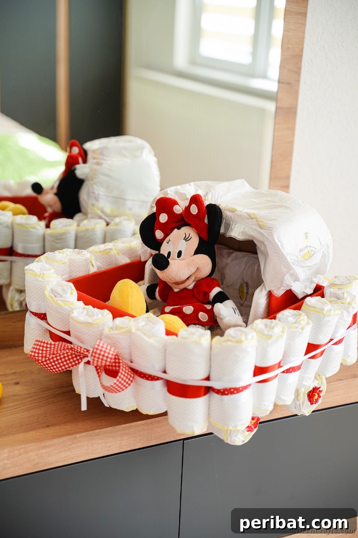 Charming Diaper Bassinet: A Perfect Baby Shower Present 27 Diaper cake bassinet displayed on a dresser, offering a charming decorative touch for a baby's room or baby shower.