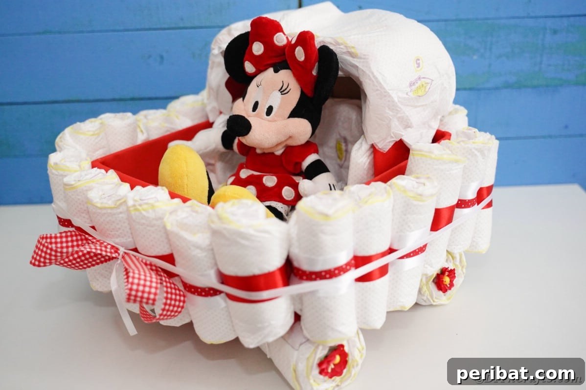 Charming Diaper Bassinet: A Perfect Baby Shower Present 5 Diaper cake bassinet by a blue wall, featuring a sweet and personalized design.