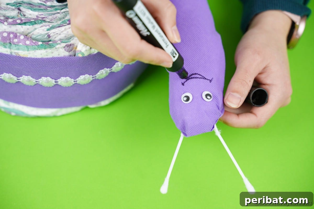A black marker delicately drawing a cheerful smile on the snail's face, completing its adorable expression.