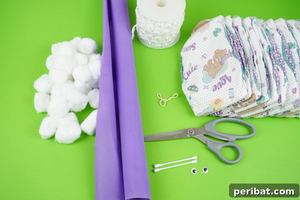A collection of supplies neatly laid out on a table, including diapers, ribbons, and crafting tools, ready for making a snail diaper cake.