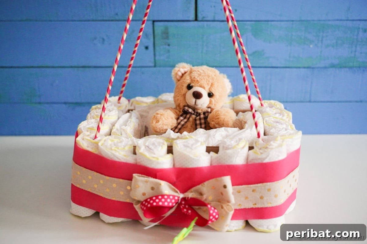 Whimsical Hot Air Balloon Diaper Cake 3 Hot air balloon diaper cake in front of blue wall