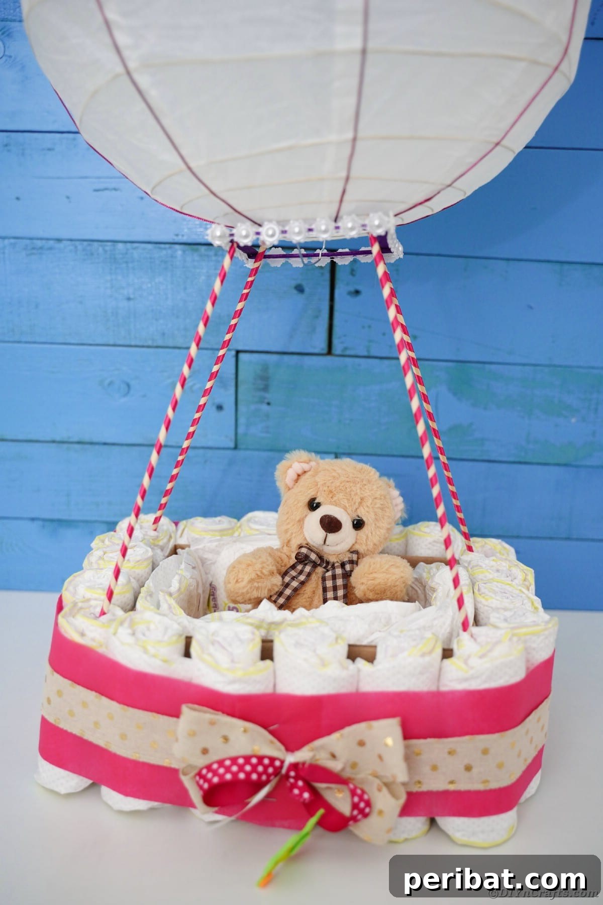 Whimsical Hot Air Balloon Diaper Cake 34 Hot air balloon diaper cake in front of blue wall