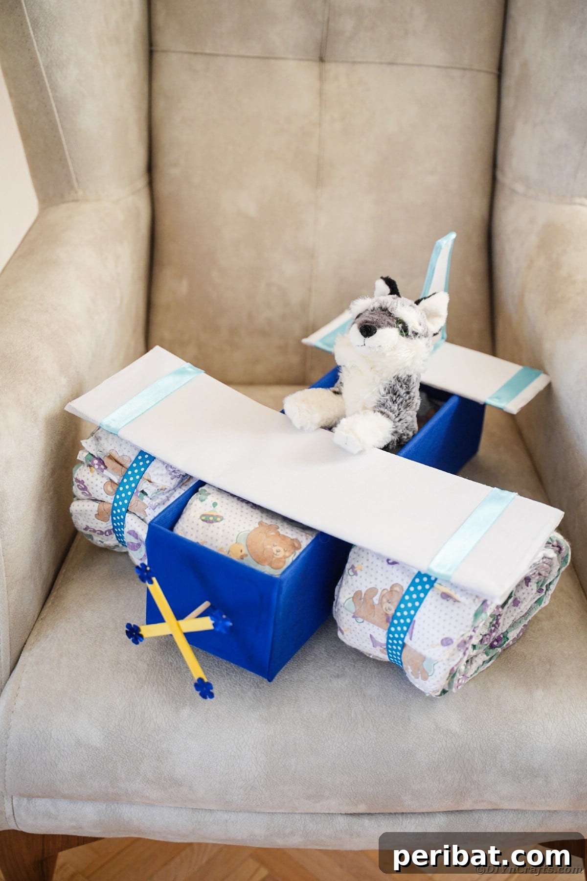Cloud Nine Diaper Plane Baby Shower Gift 26 Diaper cake on chair