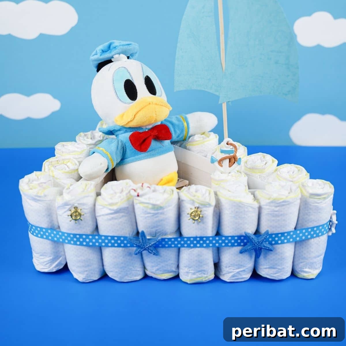 Diaper cake on blue table