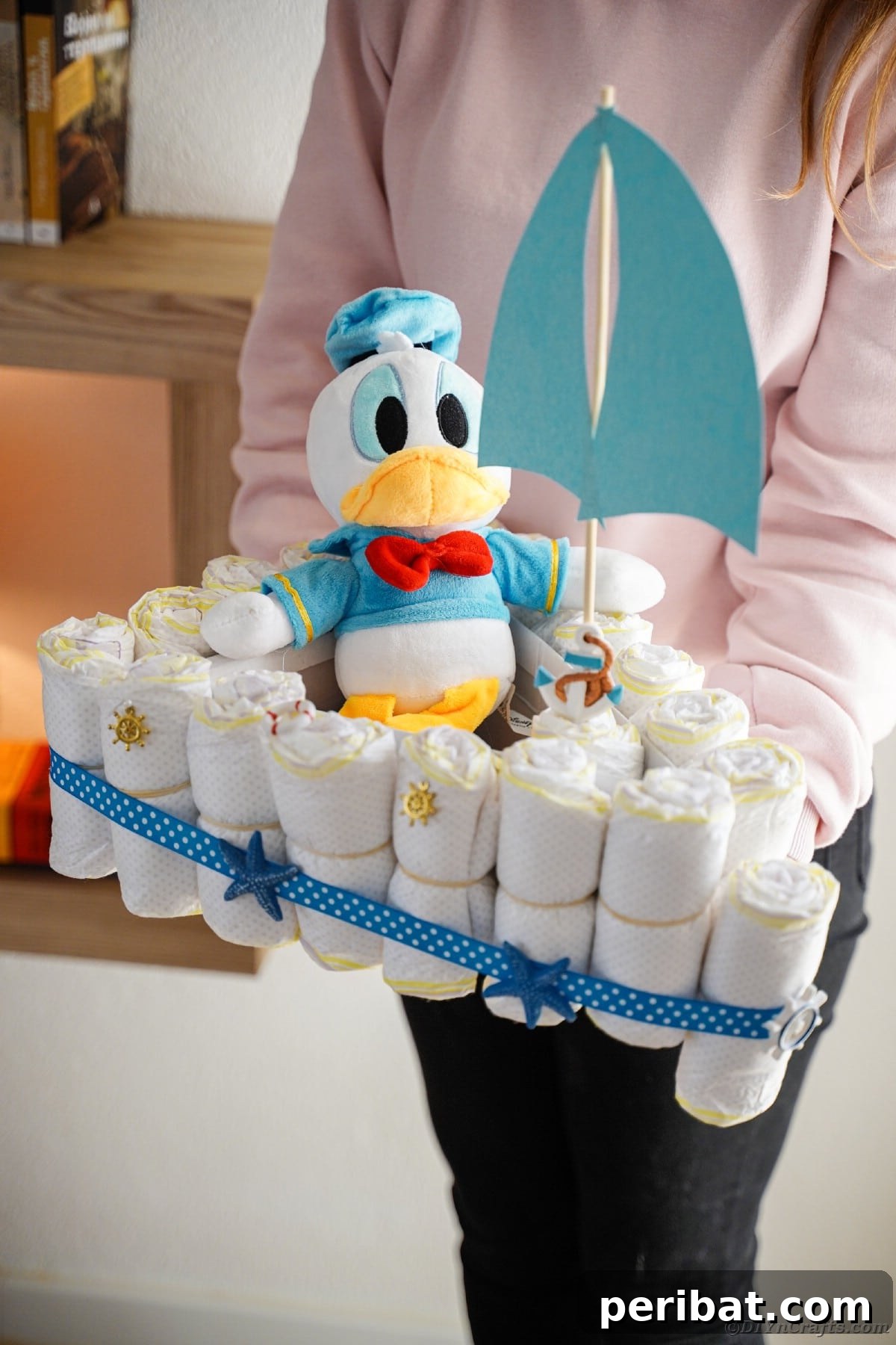 Woman holding diaper cake