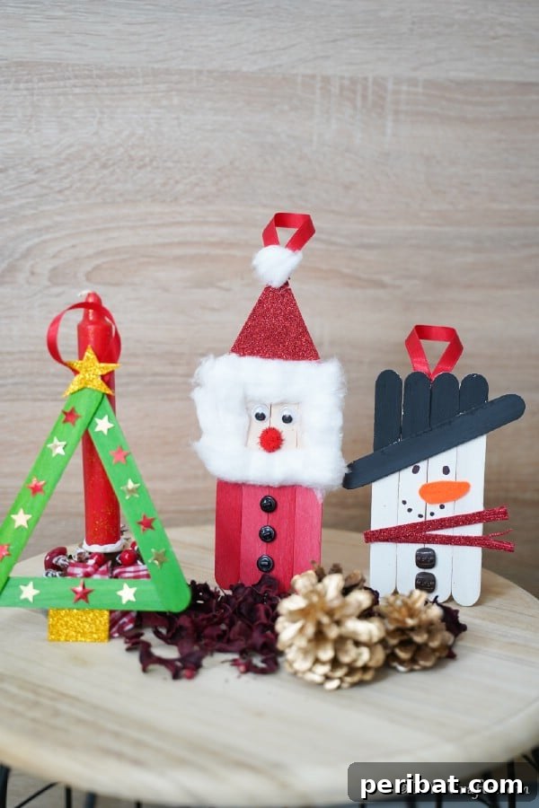 40 Christmas Craft Ideas to Spark Kids' Creativity This Winter Break 18 A collection of cheerful craft stick Christmas ornaments depicting Santa, a Christmas tree, and a snowman, ideal for kids' crafting.