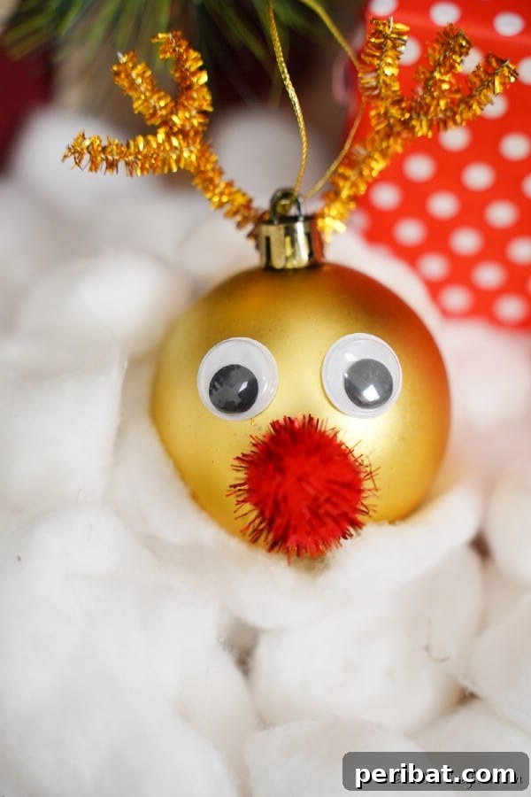 40 Christmas Craft Ideas to Spark Kids' Creativity This Winter Break 3 A sparkling Rudolph the Red-Nosed Reindeer Christmas ornament crafted from a gold bulb, featuring googly eyes and a bright red nose.