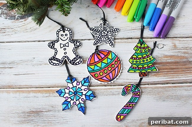 40 Christmas Craft Ideas to Spark Kids' Creativity This Winter Break 23 A selection of charming colored dough ornaments, freshly made and ready for decorating on a crafting table.