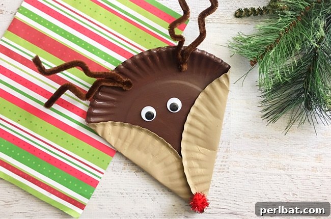 40 Christmas Craft Ideas to Spark Kids' Creativity This Winter Break 25 A playful Rudolph paper plate kids' craft with googly eyes and a red nose, displayed on a crafting table.