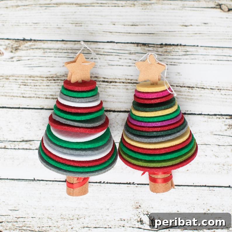 40 Christmas Craft Ideas to Spark Kids' Creativity This Winter Break 31 A collection of easy felt tree kids Christmas ornaments displayed on a table, crafted from rounds of felt for simple assembly.