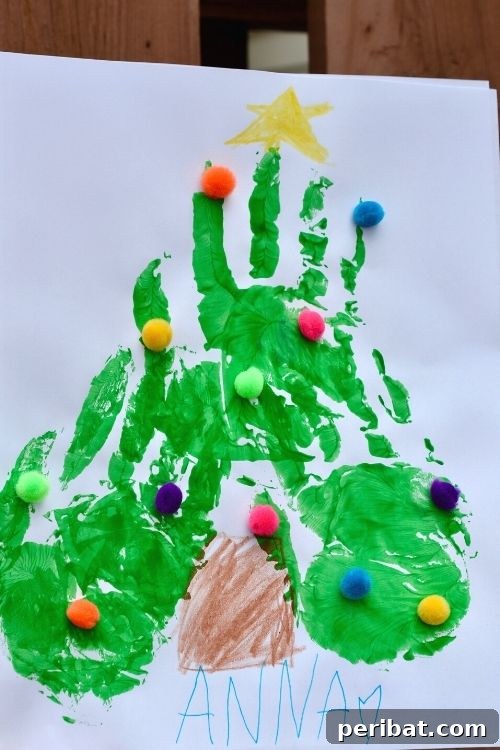 40 Christmas Craft Ideas to Spark Kids' Creativity This Winter Break 32 An adorable fingerprint Christmas tree craft, featuring painted handprints and colorful pom-poms, perfect for capturing childhood memories.