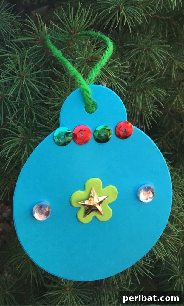 40 Christmas Craft Ideas to Spark Kids' Creativity This Winter Break 38 A colorful foam ornament, showcasing a unique spin on traditional round ornament looks, perfect for kids to customize.