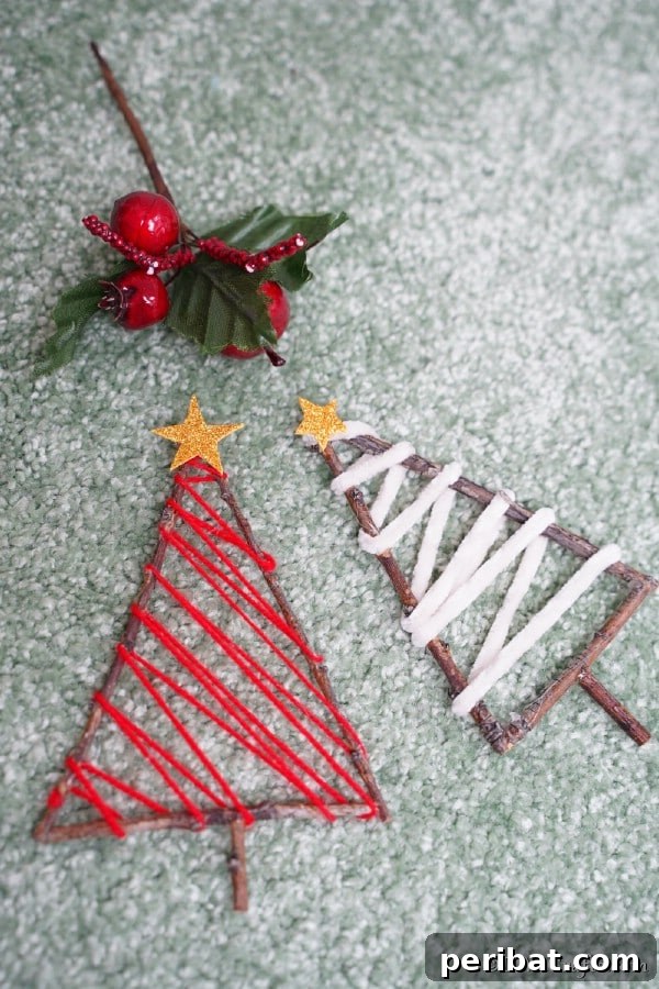 40 Christmas Craft Ideas to Spark Kids' Creativity This Winter Break 5 A collection of rustic twig Christmas tree ornaments displayed on a wooden table, adorned with simple ribbon and twine.