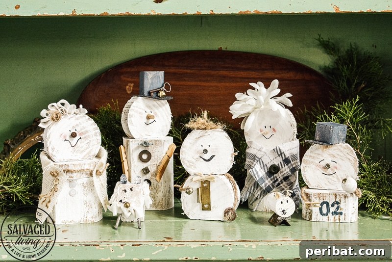 A charming snowman family decoration crafted from various sizes of scrap wood, adorned with painted features, small hats, and bolts for noses, arranged on a rustic surface.