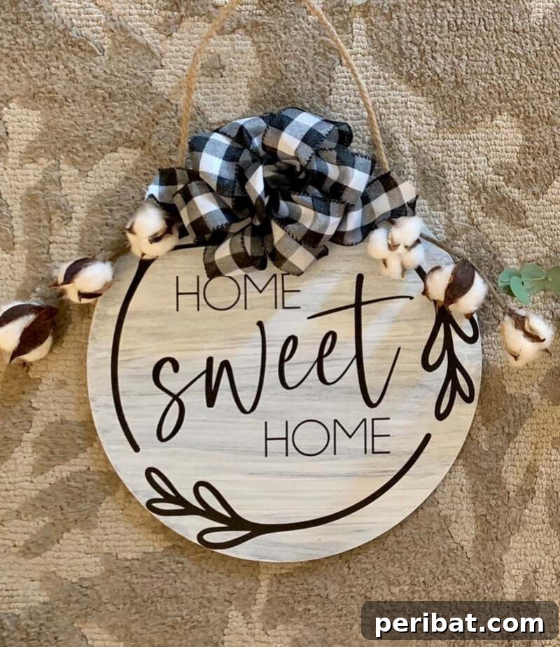 Rustic Farmhouse Wreaths for Year-Round Beauty 18 Wooden 'Home Sweet Home' sign with decorative greenery and bow