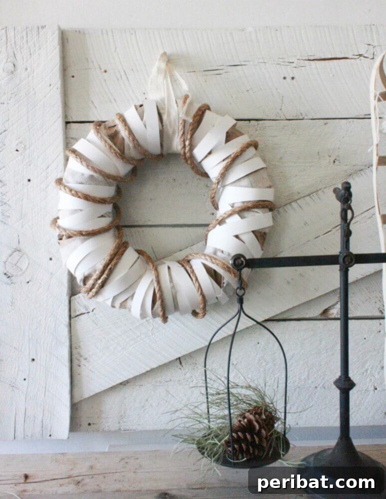 Rustic Farmhouse Wreaths for Year-Round Beauty 20 White and brown farmhouse wreath crafted from rolled paper and rope