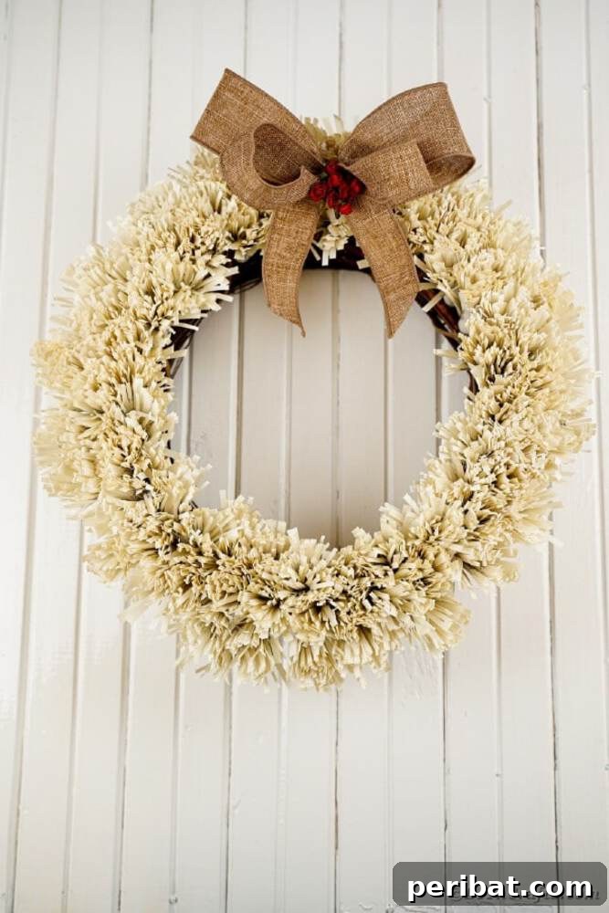 Rustic Farmhouse Wreaths for Year-Round Beauty 3 Rustic fringed wreath crafted from old book pages, adorned with burlap and flowers