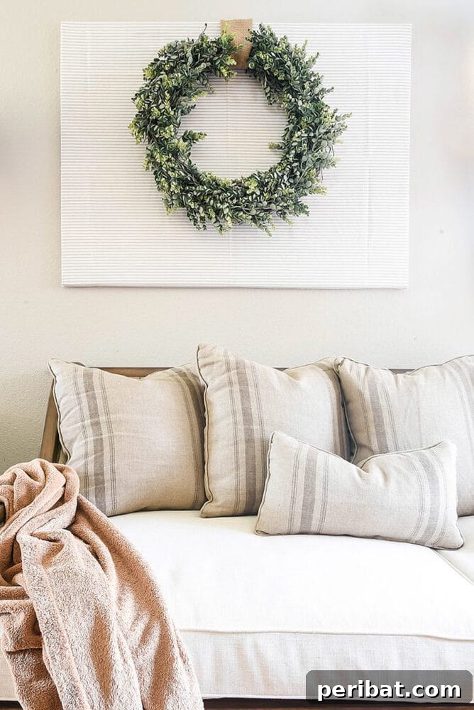 Rustic Farmhouse Wreaths for Year-Round Beauty 22 Simple farmhouse greenery wreath mounted as wall decor
