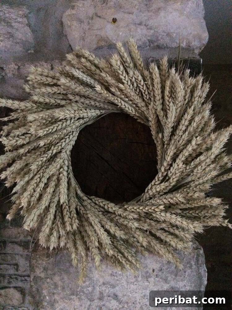 Rustic Farmhouse Wreaths for Year-Round Beauty 24 Beautiful dried natural wheat wreath, a simple farmhouse decor idea