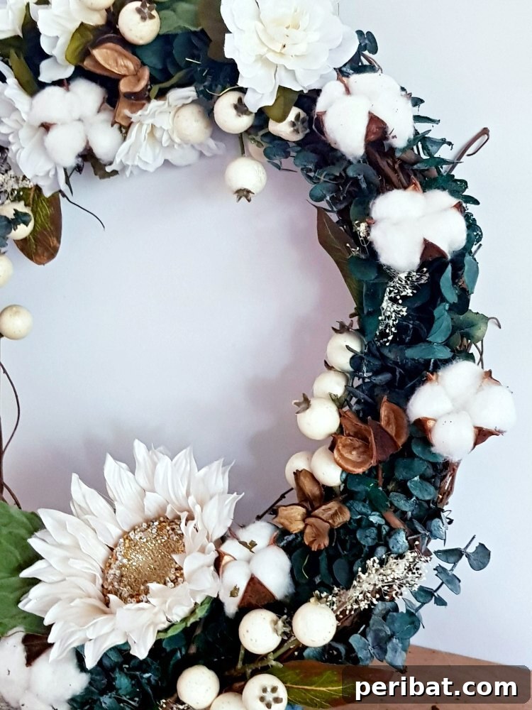 Rustic Farmhouse Wreaths for Year-Round Beauty 25 Stunning dark greenery wreath with cotton, flowers, and vines for a rustic farmhouse look