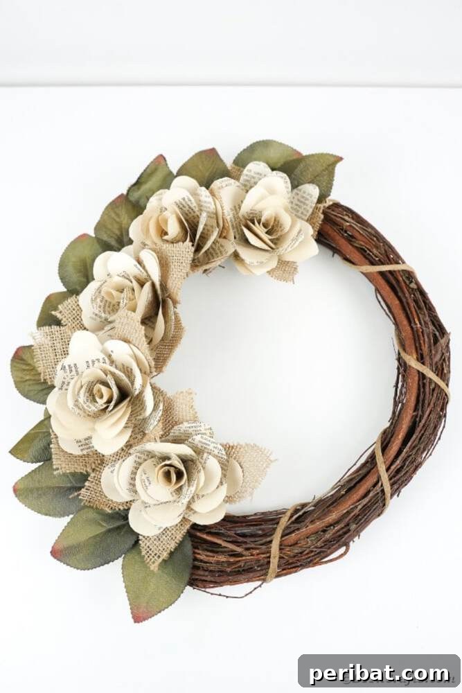 Rustic Farmhouse Wreaths for Year-Round Beauty 4 Grapevine wreath adorned with rustic paper roses and artificial leaves