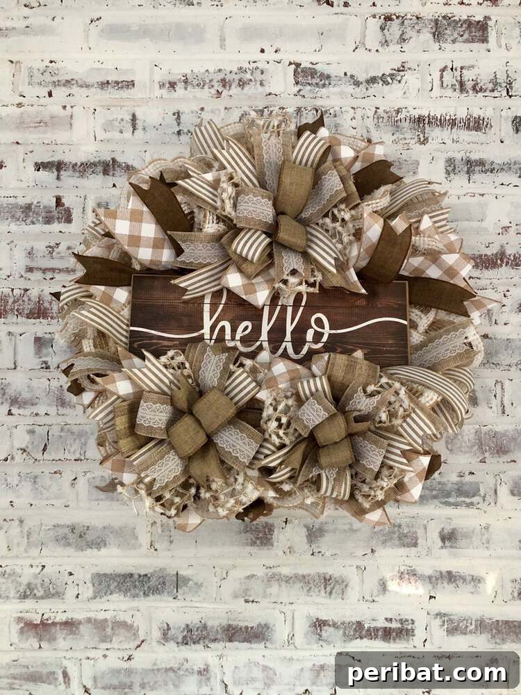 Rustic Farmhouse Wreaths for Year-Round Beauty 31 Burlap and ribbon 'Hello' wreath in basic brown and cream colors