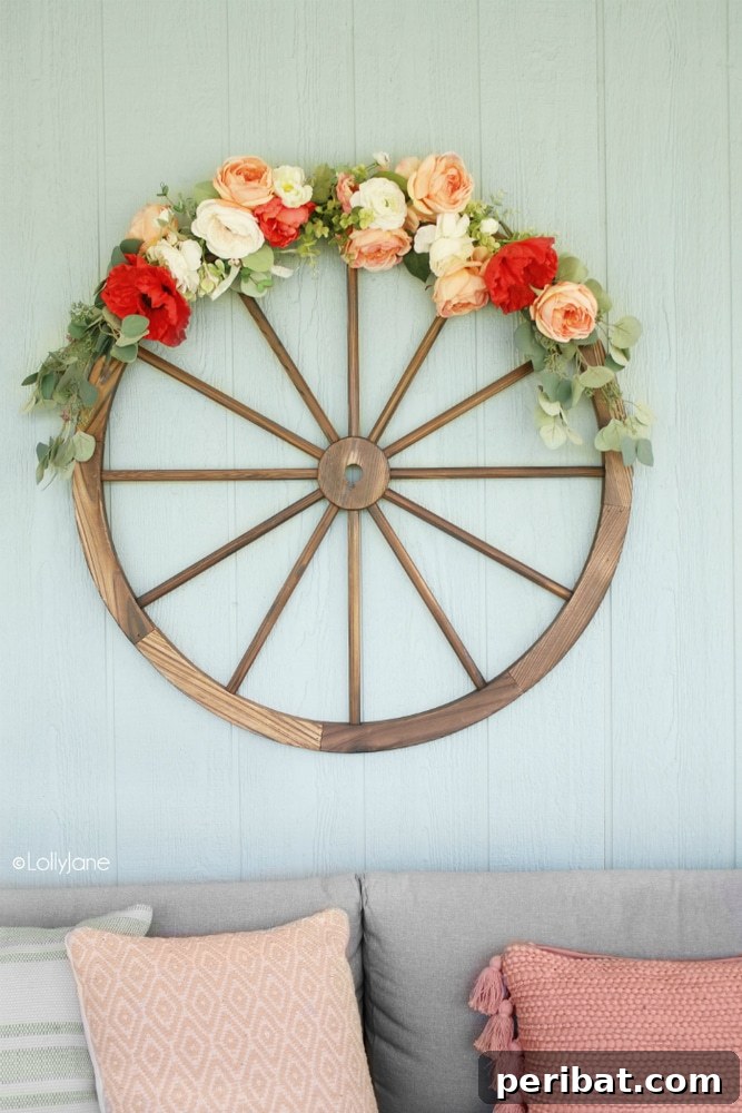 Rustic Farmhouse Wreaths for Year-Round Beauty 33 Wagon wheel wreath adorned with brightly colored summer flowers