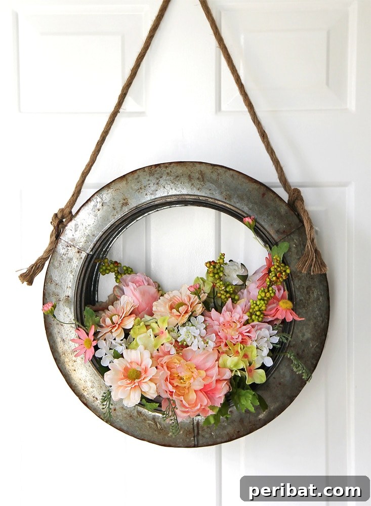 Rustic Farmhouse Wreaths for Year-Round Beauty 34 Upcycled tire rim wreath decorated with seasonal flowers