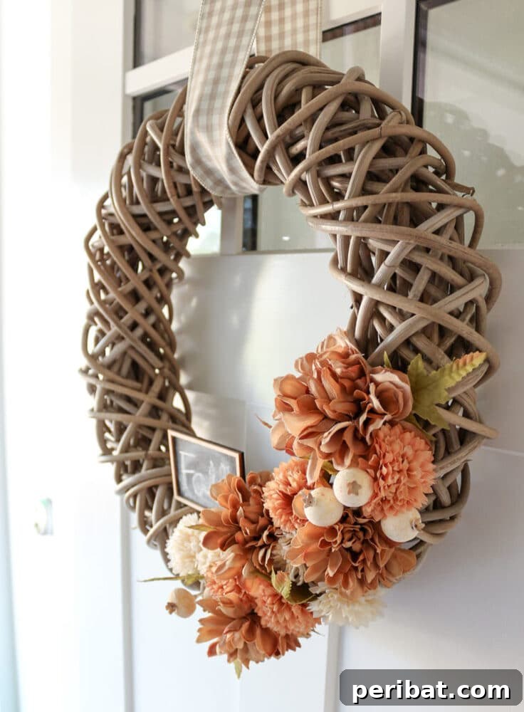 Rustic Farmhouse Wreaths for Year-Round Beauty 36 Grapevine wreath with a single large flower and ribbon for fall decor