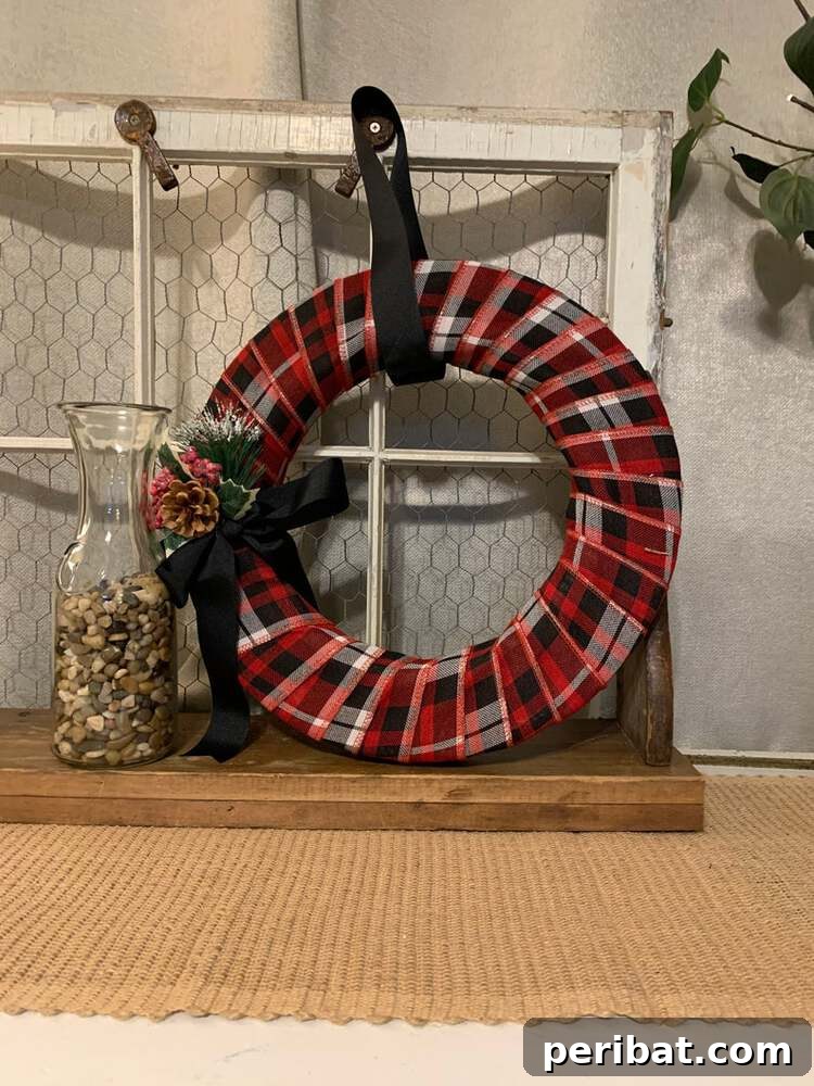 Rustic Farmhouse Wreaths for Year-Round Beauty 8 Simple yet beautiful red plaid country wreath for a farmhouse door