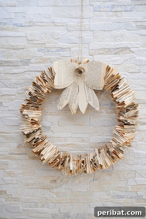 Beyond the Covers: Old Book Craft and Decor Inspiration 20 Fold book page wreath on brick wall