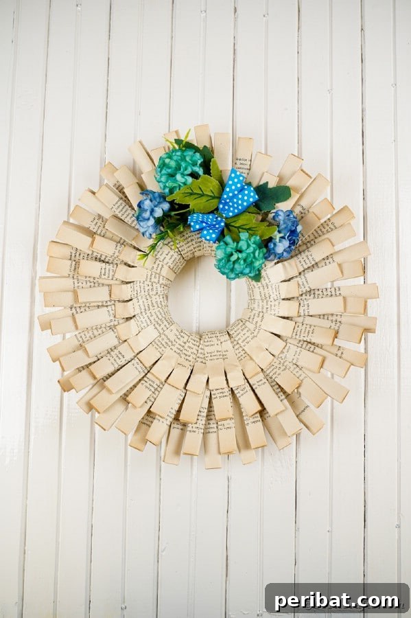 Beyond the Covers: Old Book Craft and Decor Inspiration 22 Old book page wreath on white wall