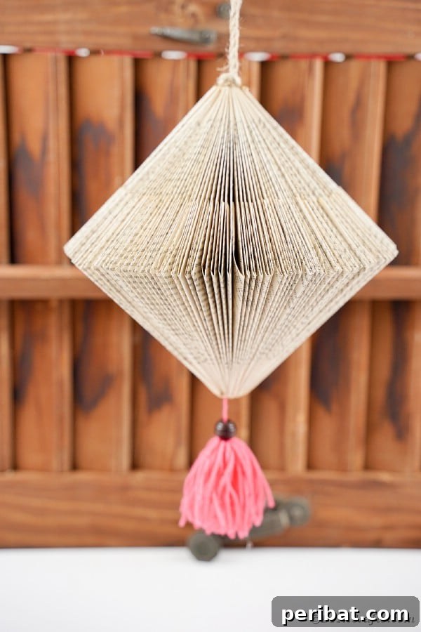 Beyond the Covers: Old Book Craft and Decor Inspiration 27 Hanging paper lantern with tassel