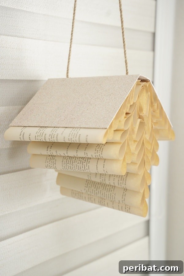 Beyond the Covers: Old Book Craft and Decor Inspiration 29 Hanging paper fern
