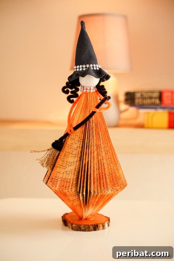 Beyond the Covers: Old Book Craft and Decor Inspiration 40 Orange paper halloween witch