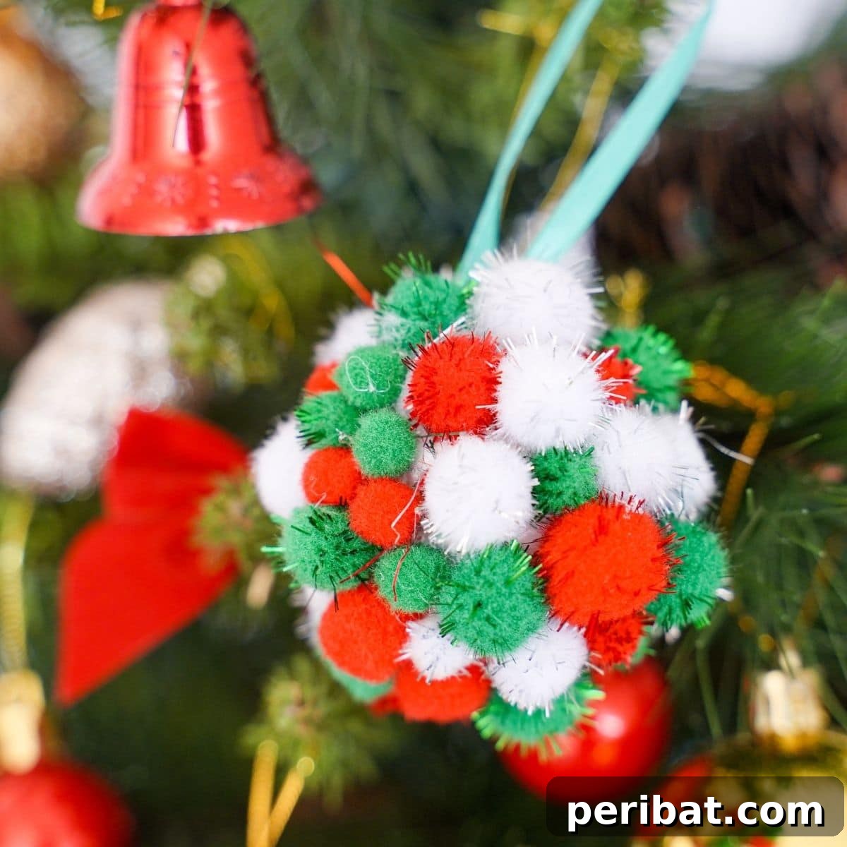 Craft Your Own Fluffy Pom Pom Christmas Ornaments 2 Pom pom ornament on tree