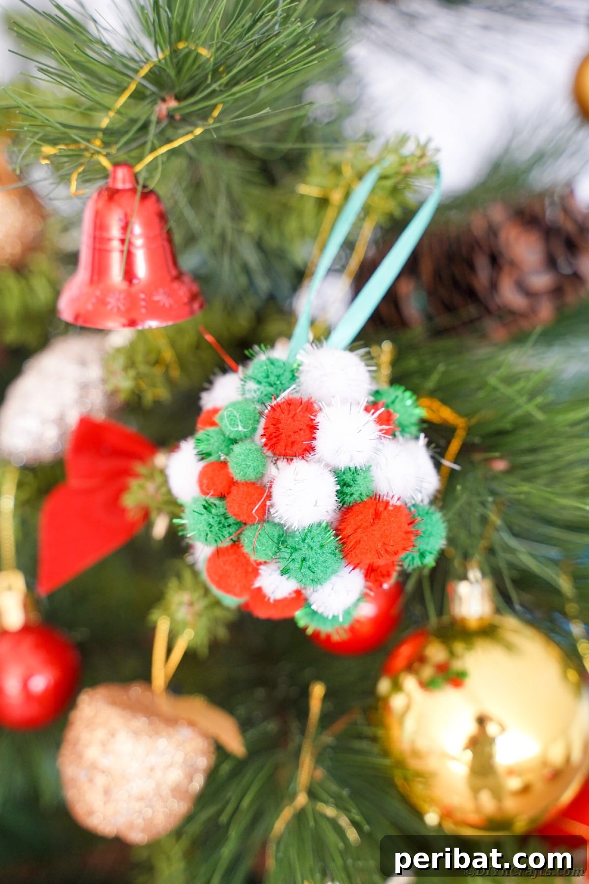 Craft Your Own Fluffy Pom Pom Christmas Ornaments 11 Pom pom ornament on tree